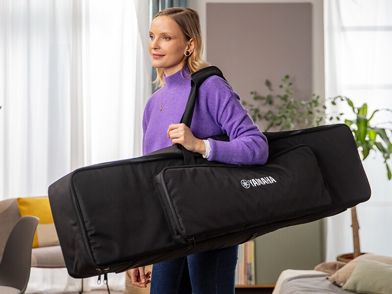 A person carrying the P-145BT dedicated keyboard bag on their shoulder